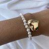 Pulsera perla con corazón hueco